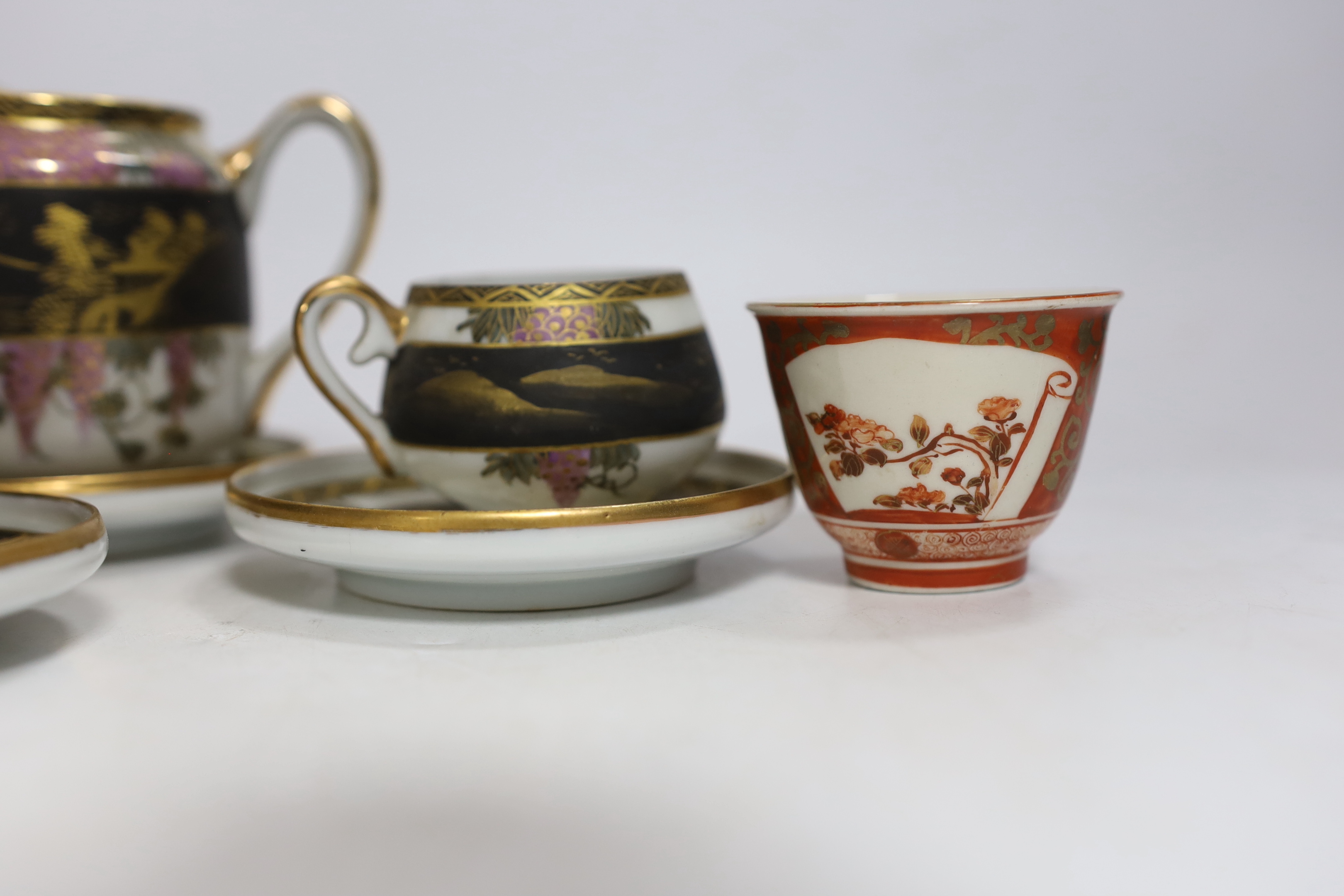 A Chinese white metal unsigned pot and cover, 5cm high, together with two Japanese Kutani tea bowls, 19th century and a Japanese egg shell part tea set